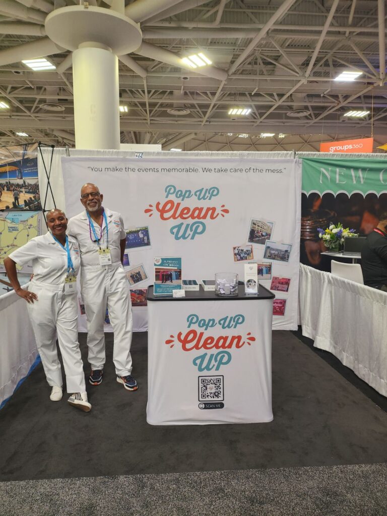 CEO of PopUP CleanUP Kenetia Lee and her right hand husband Thorne Smith in their booth at BizBash expo 2023.