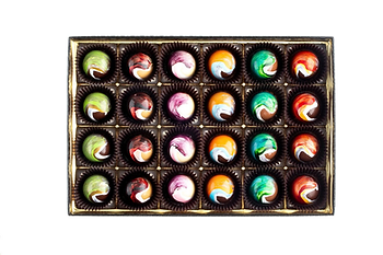 A box of Philip Ashley chocolate bonbons with swirling color shells.