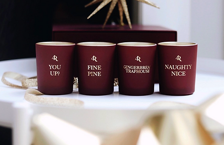 Luxury candles with words on them such as "You up?"  "Fine Pine" "Naughty Nice"