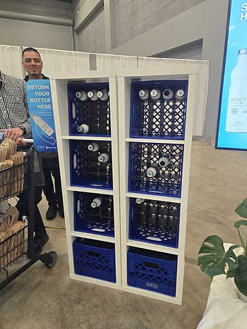 Used water bottle racks for bottle recycling at the Austin Convention Center, Catersource 2024.