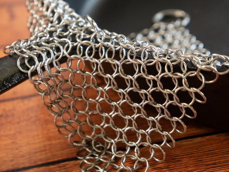 Linked metal chains of a chain scrubber.