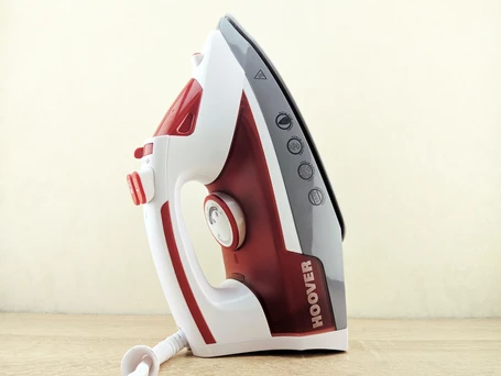 A red and white Hoover iron