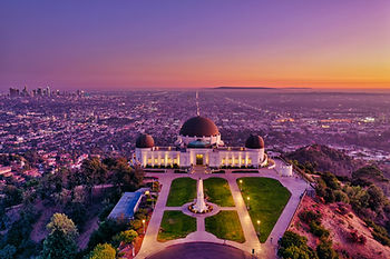 Griffith Park Observatory overlooking the city of Los Angeles looking towards Palos Verdes at sunset.