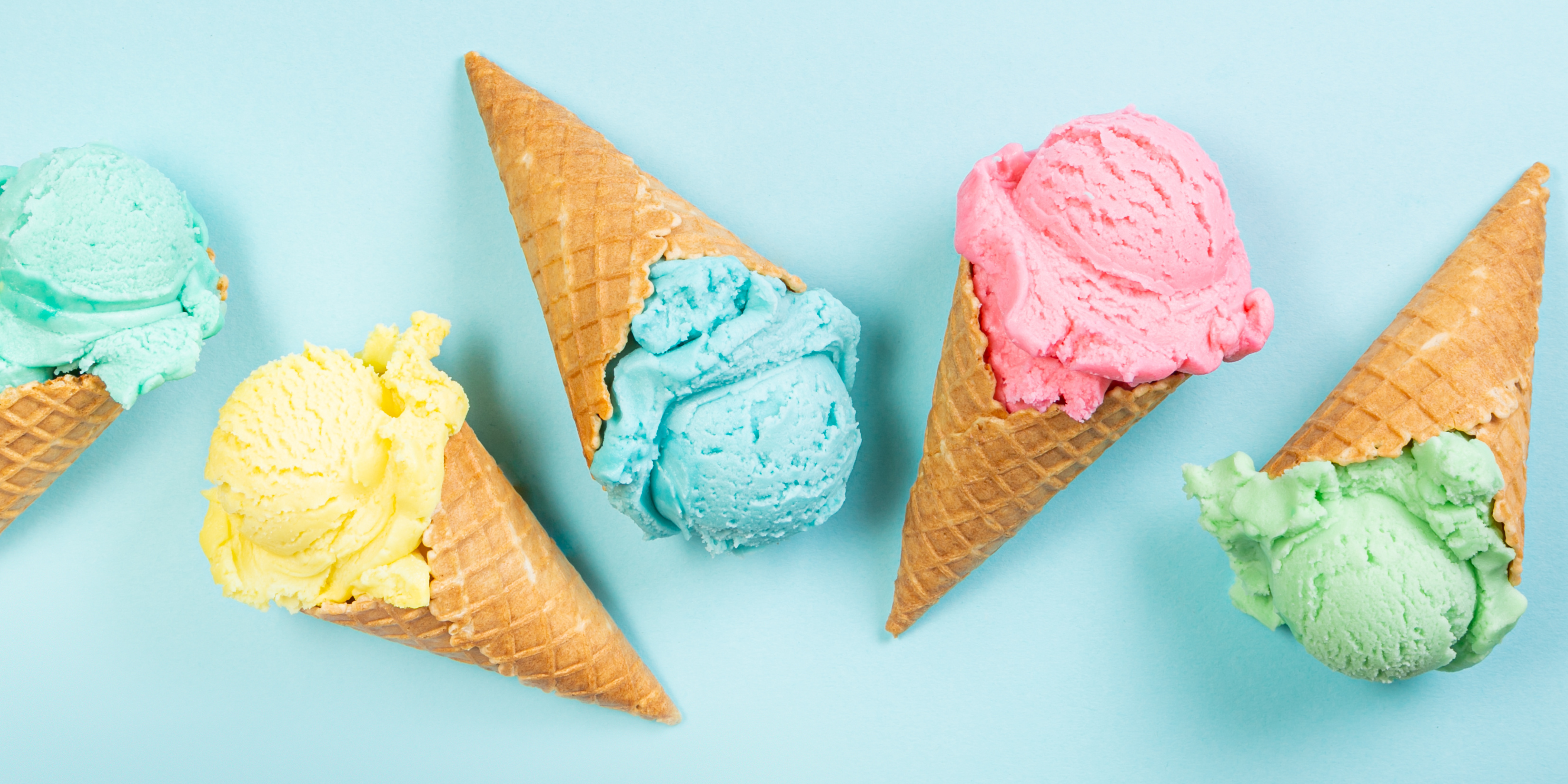 Yellow, pink, green, and blue ice cream cones.