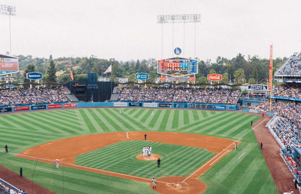 Dodger Stadium with a full crowd during a mound visit at an MLB game.